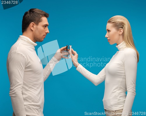 Image of man and woman with modern gadgets