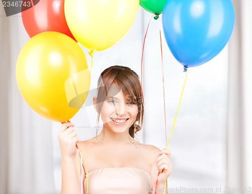 Image of happy teenage girl with balloons