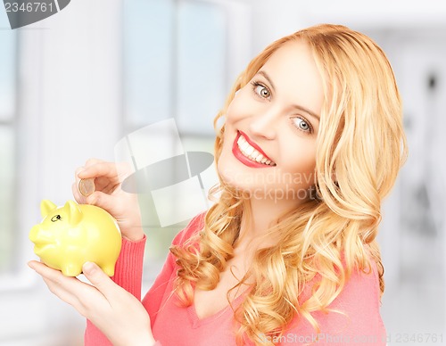 Image of woman with piggy bank and cash money