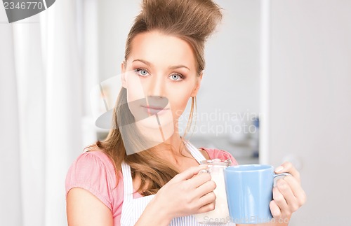 Image of housewife with milk and mug