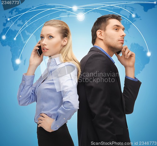 Image of man and woman with cell phones