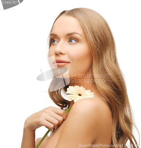 Image of lovely woman with gerbera flower