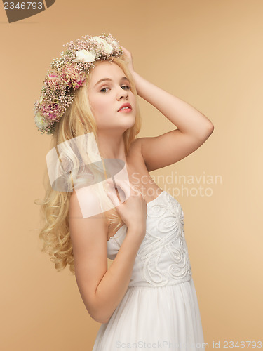 Image of woman wearing wreath of flowers