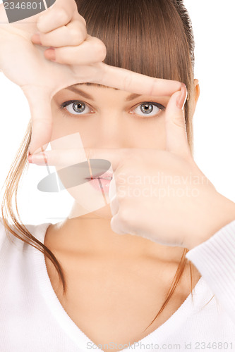 Image of woman creating a frame with fingers