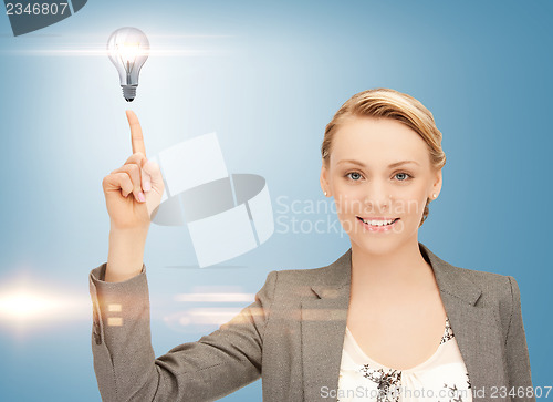 Image of woman pointing her finger at light bulb