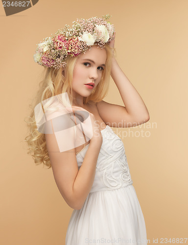 Image of woman wearing wreath of flowers