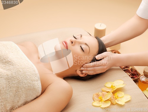 Image of beautiful woman in massage salon