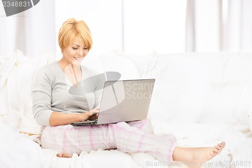 Image of happy woman with laptop computer