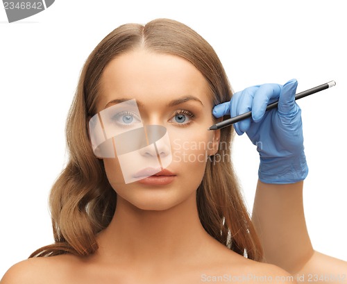 Image of woman face and beautician hands