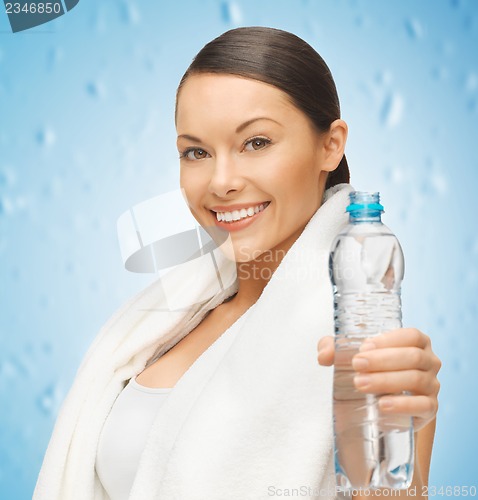 Image of woman with towel and bottle of water