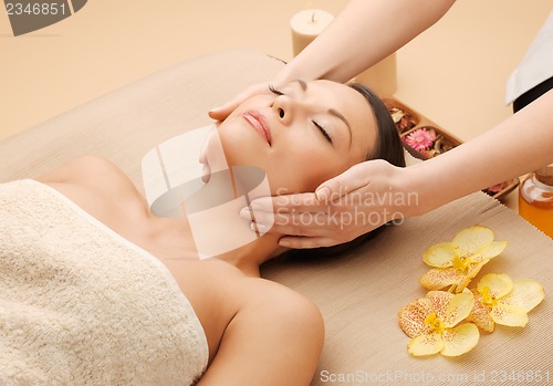 Image of beautiful woman in massage salon