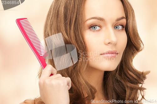 Image of beautiful woman with comb