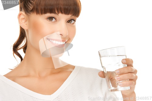 Image of young smiling woman with glass of water