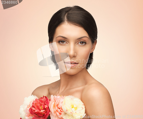 Image of relaxed woman with flowers