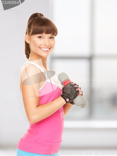Image of fitness instructor with dumbbells