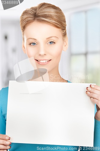 Image of happy smiling woman with blank paper