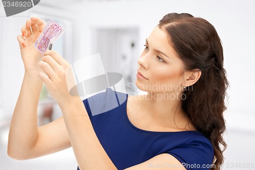 Image of lovely woman with euro cash money