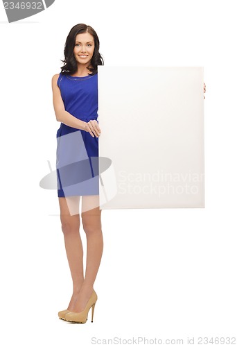 Image of lovely woman in blue dress with blank board