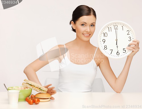 Image of woman with big clock