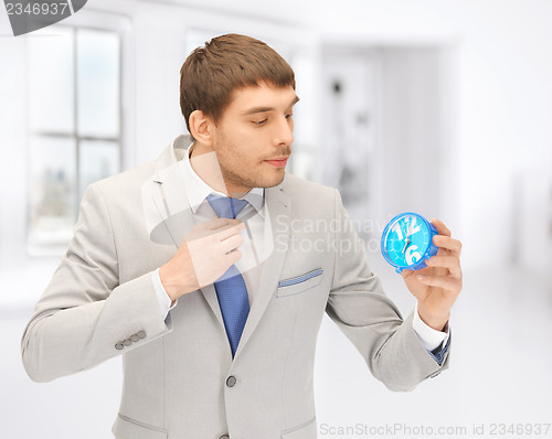 Image of man with clock