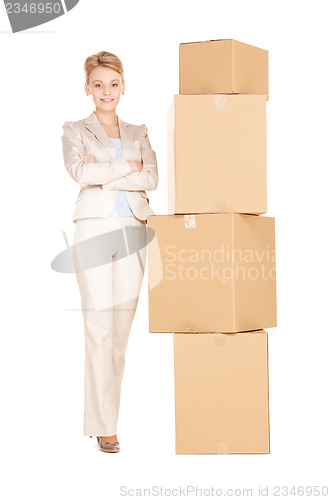 Image of businesswoman with big boxes