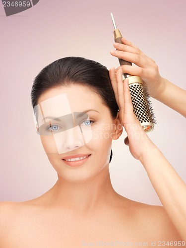 Image of beautiful woman with comb