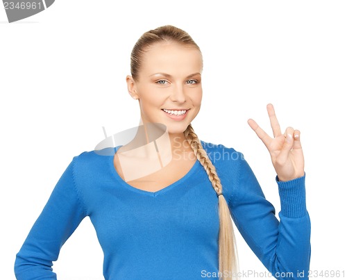 Image of young woman showing victory sign