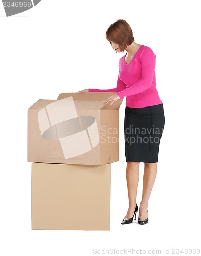 Image of businesswoman with big boxes