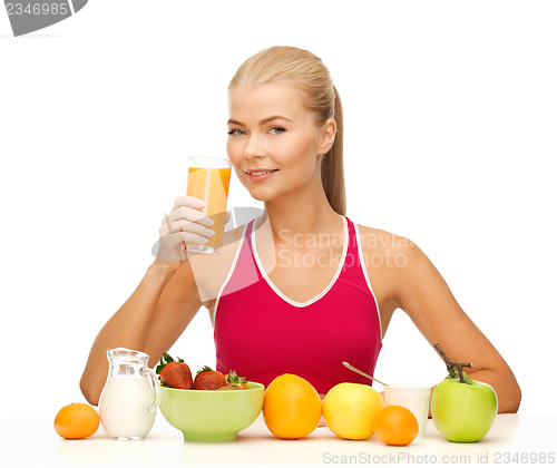 Image of young woman eating healthy breakfast