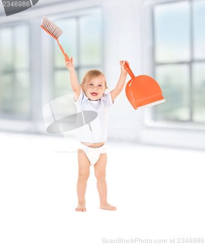 Image of baby boy with with dustpan and brush