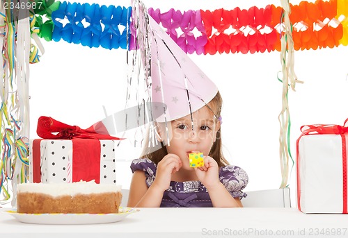 Image of litle girl with birthday cake