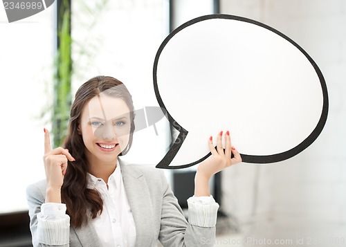 Image of smiling businesswoman with blank text bubble