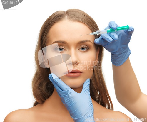 Image of woman face and beautician hands