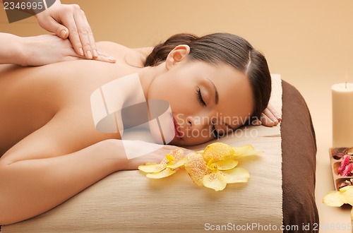 Image of beautiful woman in massage salon