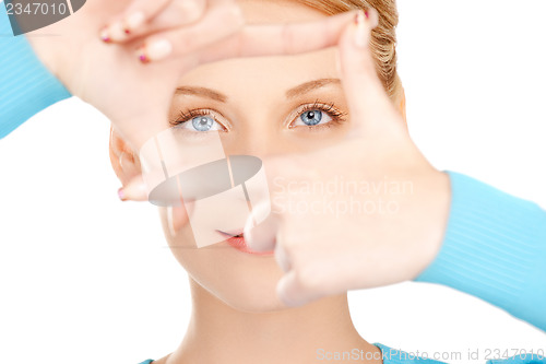 Image of woman creating a frame with fingers