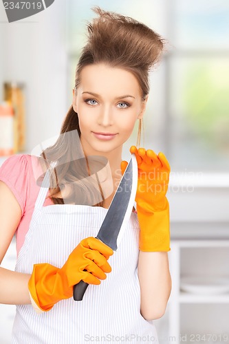 Image of housewife with big knife