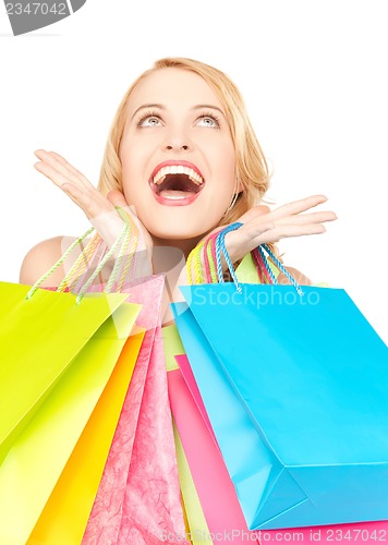 Image of happy woman with shopping bags