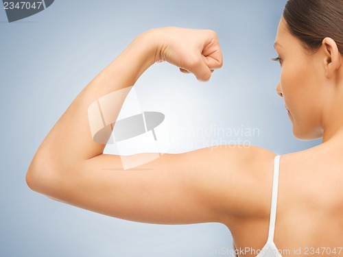 Image of sporty woman flexing her biceps