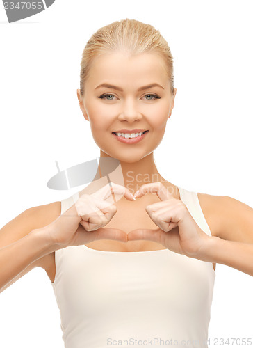 Image of woman showing heart shape gesture
