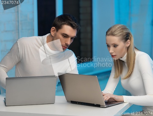 Image of man and woman in laboratory