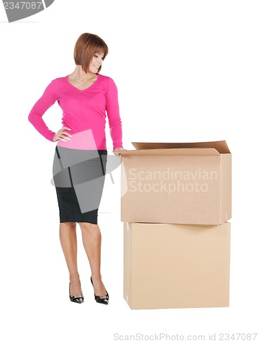 Image of businesswoman with big boxes