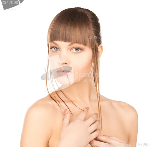 Image of face and hands of beautiful woman