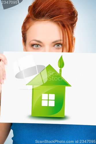 Image of woman with illustration of green eco house