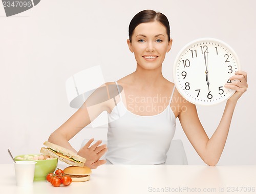 Image of woman with big clock