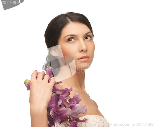 Image of relaxed woman with flowers