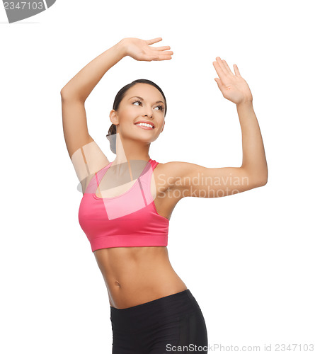 Image of sporty woman in aerobic or dance movement