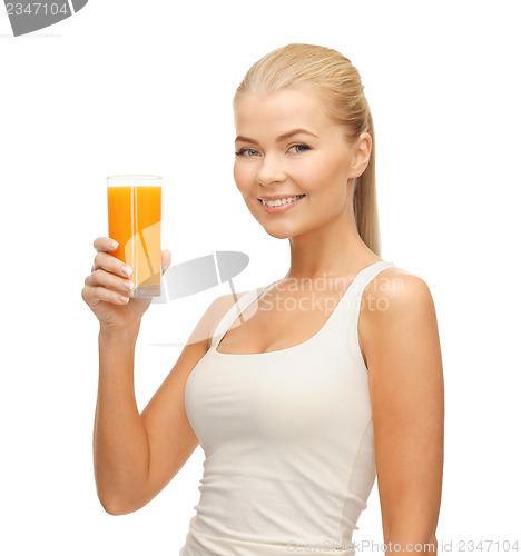Image of woman holding glass of orange juice