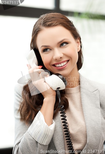 Image of businesswoman with cell phone calling