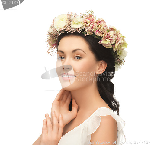 Image of woman wearing wreath of flowers