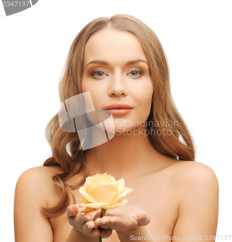 Image of lovely woman with rose flower